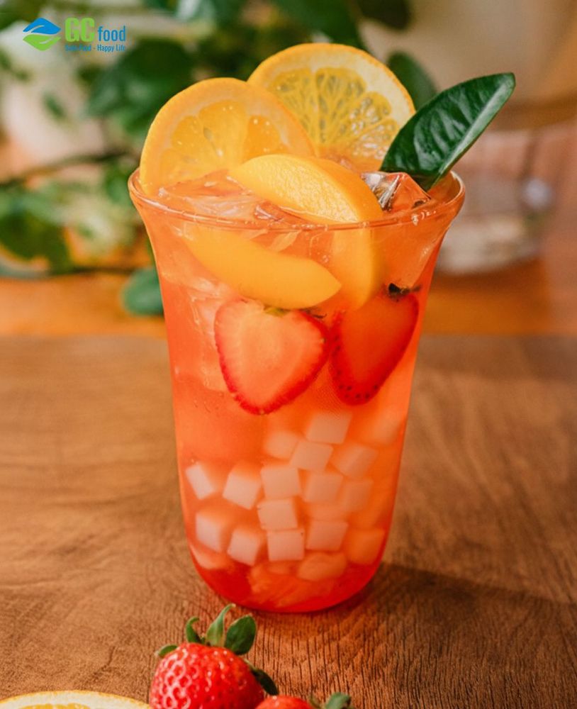 A refreshing glass of orange peach strawberry tea-cool, fragrant, and perfectly balanced with a light sweet-tart taste.