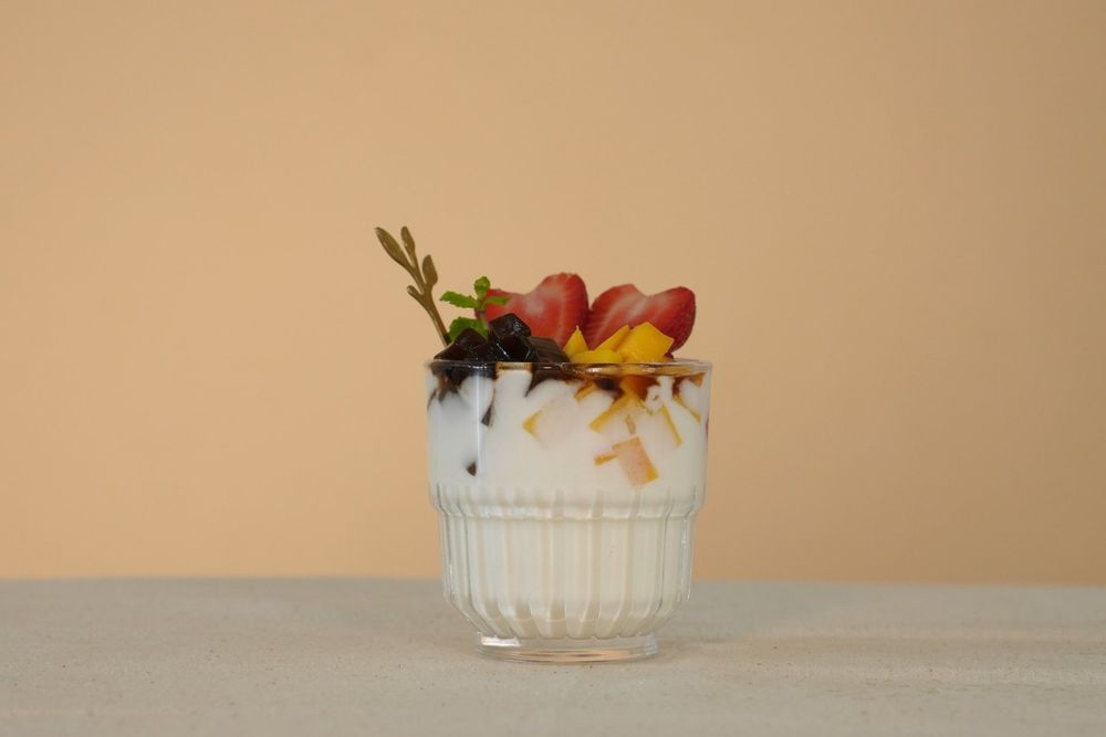 You can make nata de coco yogurt more interesting by mixing in fresh fruits for added flavor and variety.