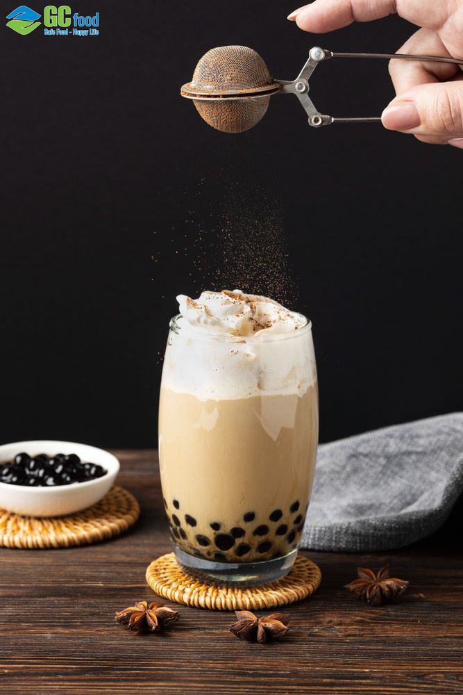 Milk tea with roasted coconut egg cream, served with chewy coconut jelly topping.